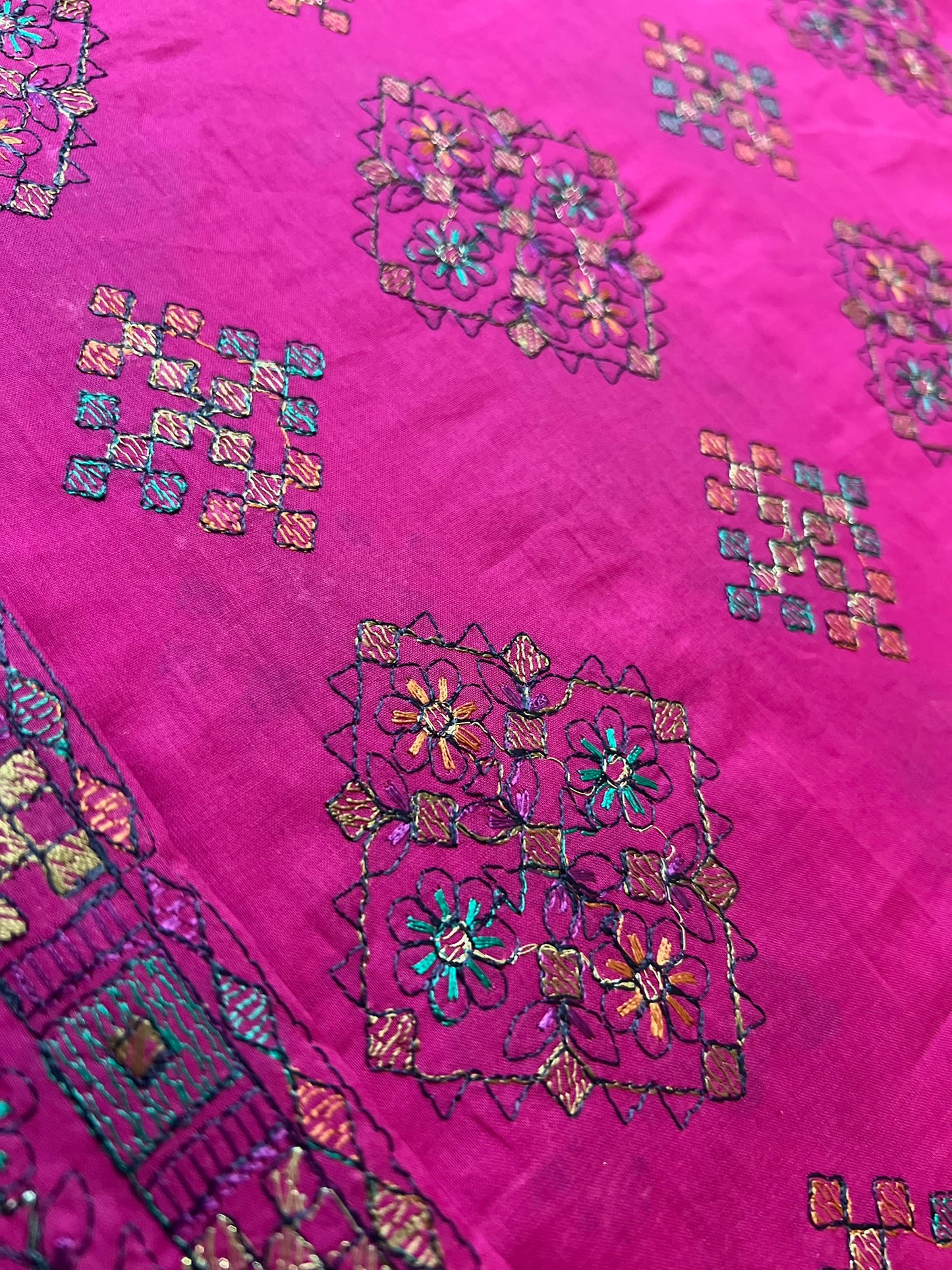 Fabareeze Fuchsia Pink Embroidered Lawn fabric close-up