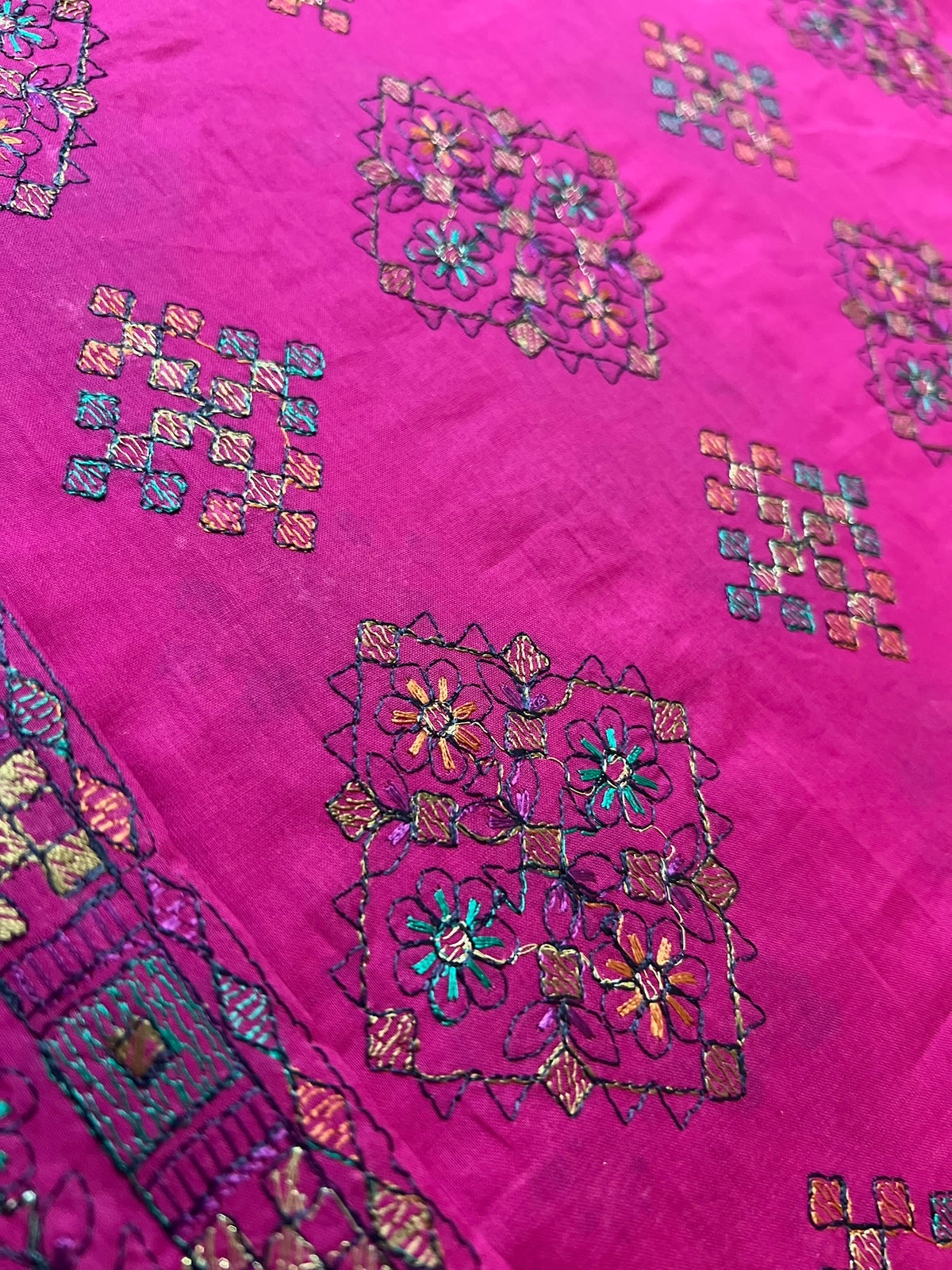Fabareeze Fuchsia Pink Embroidered Lawn fabric close-up