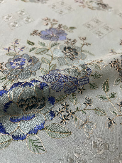 Fabareeze Ice Blue Embroidered Karandi fabric close-up