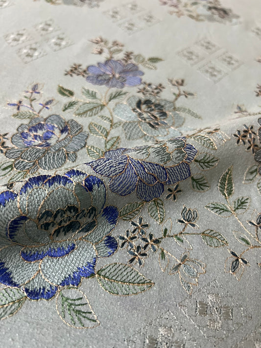 Fabareeze Ice Blue Embroidered Karandi fabric close-up