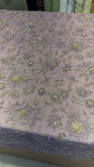 Close-up of hand-done bead and sequin embellishment on lilac chiffon